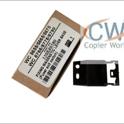 A cardboard box labeled Fixing Magnetic Lever Base for Xerox wc 5655/5665/5675/5765/5775/5790 (Fuser exit switch) by Copier World sits next to a small black Xerox printer bracket. Quantity: 2.