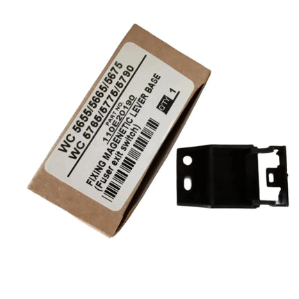 A cardboard box labeled Fixing Magnetic Lever Base for Xerox wc 5655/5665/5675/5765/5775/5790 (Fuser exit switch) by Copier World sits next to a small black Xerox printer bracket. Quantity: 2.
