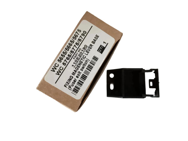 A cardboard box labeled Fixing Magnetic Lever Base for Xerox wc 5655/5665/5675/5765/5775/5790 (Fuser exit switch) by Copier World sits next to a small black Xerox printer bracket. Quantity: 2.