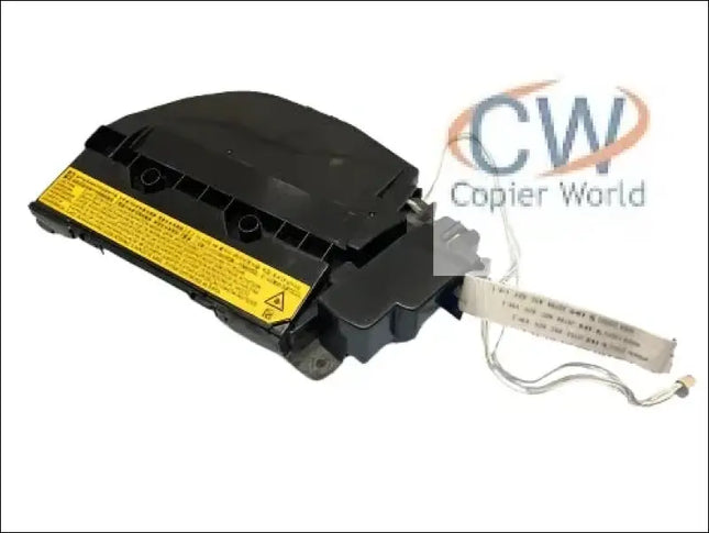 A black car airbag module with a yellow warning label and attached wiring harness is displayed on a white background, similar to the meticulous re-conditioning done by Copier World for the kyocera 2040 laser unit.